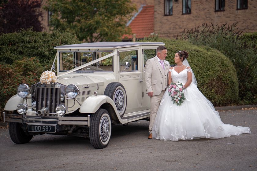 The bride and groom beside the ivory Imperial Viscount, registration UDO 587.